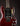 Red electric guitar with a dark background