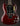Red electric guitar on a dark background