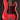 Red electric bass guitar with a dark tortoise pickguard on a black background