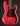 Red electric bass guitar with a dark tortoise pickguard on a black background