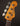 Fender Precision Bass headstock with tuning pegs on a dark background