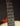 Close-up of a guitar's fretboard with dark background