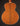 Back view of a wooden acoustic guitar on a dark background