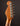 Close-up of a guitar headstock with tuning pegs on a dark background