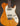 Electric guitar with a wooden body and pearloid pickguard on a dark background