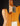 Close-up of a wooden electric guitar on a dark background