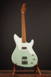 Electric guitar on a stand against a dark background