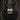 Black electric guitar on a dark background