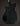 Black electric guitar body on a dark background