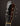 Guitar headstock with 'Koll' branding on a dark background