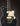 Black electric guitar with a white pickguard on a dark background