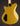 Gold electric guitar on a dark background, back view