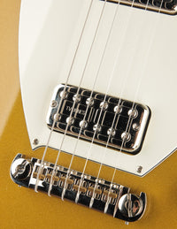 Close-up of a guitar's bridge and pickups