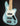 Light blue electric bass guitar on a black background