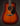 Martin acoustic guitar with a sunburst finish on a dark background