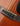 Close-up of a guitar's soundboard with strings and bridge