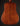Martin acoustic guitar on a dark background, from the back