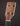 Close-up of a banjo headstock with tuning pegs on a dark background