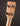 Close-up of a banjo headstock with tuning pegs on a dark background