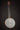 Banjo on a standçagainst a dark background