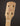 Close-up of a banjo headstock with tuning pegs on a dark background