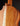 Close up of the back of a classical guitar on a dark background
