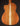 Back view of a classical guitar with a dark background