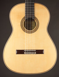 Classical guitar on a black background
