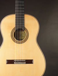 Classical guitar on a black background