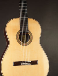 Classical guitar on a black background