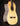 Classical guitar on a black background, from the side