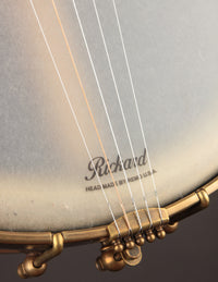 Close up of tailpiece on a Rickard banjo.