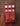 Red effects pedal on wood background