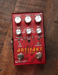 Red effects pedal on wood background