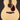 Acoustic guitar with a natural finish on a black background
