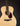 Acoustic guitar with tortoiseshell pickguard on a black background
