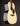 Acoustic guitar with a natural finish on a black background