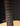 Close-up of a guitar's fretboard against a dark background