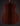 Back view of a wooden acoustic guitar on a dark background