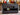 Black Swart amplifier with guitars in the background