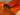 Close-up detail of a glossy wooden instrument body corner with layered wood inlays and a warm orange-brown finish.
