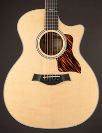 Taylor acoustic guitar on a dark background