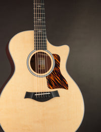 Taylor acoustic guitar on a dark background