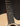 Close up of fingerboard on a Taylor acoustic guitar on a dark background