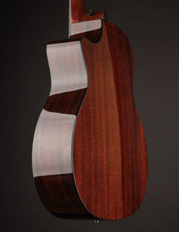 Back and sides on a Taylor acoustic guitar on a dark background
