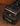 Close-up of a VOX guitar pedal on a wooden surface
