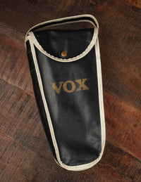 Black Vox case on a wooden surface