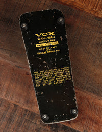 Underside of VOX Wah-Wah pedal on a wooden surface
