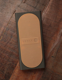A top view of the Lehle Mono Volume S Pedal showing the pedal's body with a tan-colored top surface and the brand name 'LEHLE' on it.